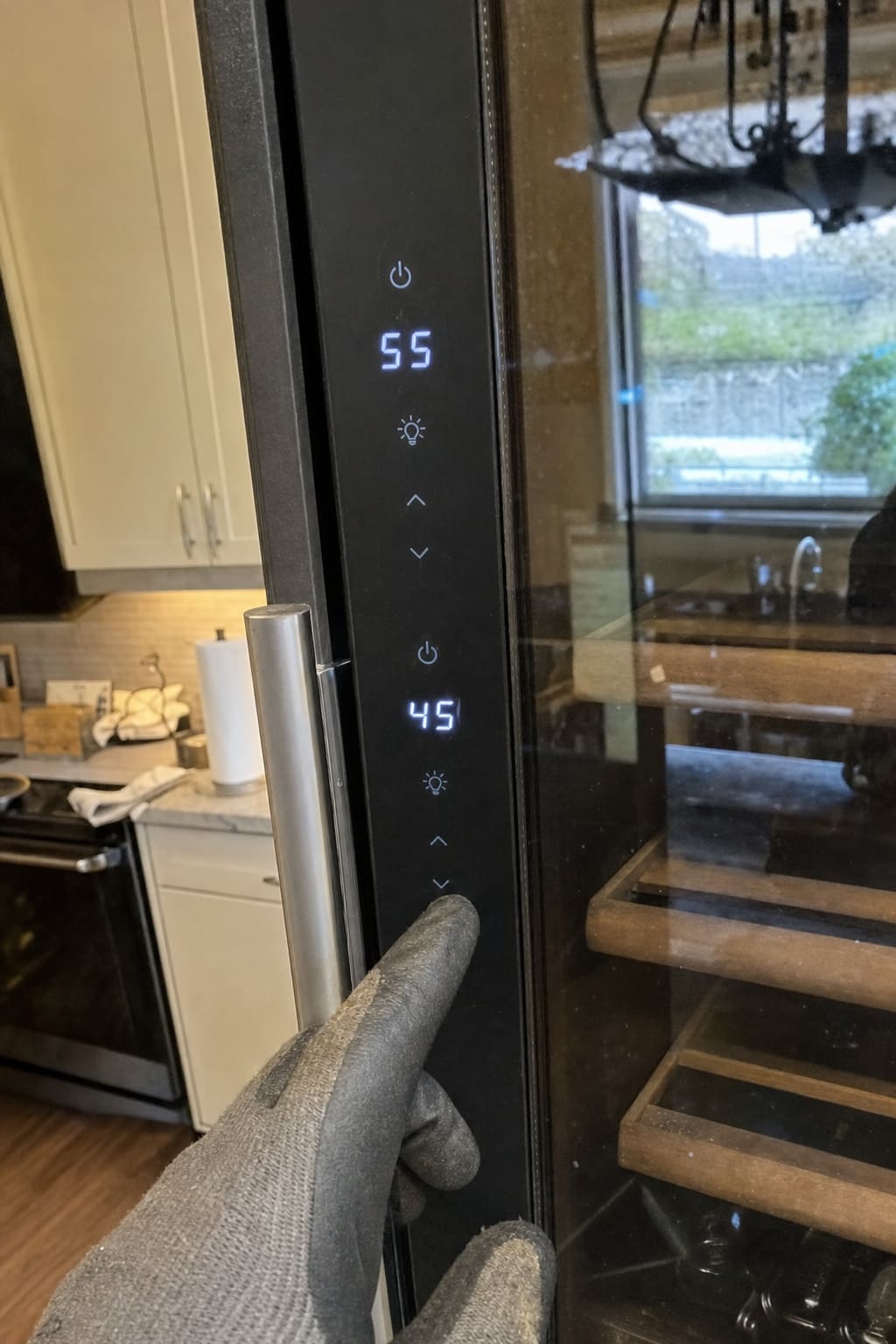 Wine cooler control panel showing an upper zone set to 55 degrees and a lower zone set to 45 degrees